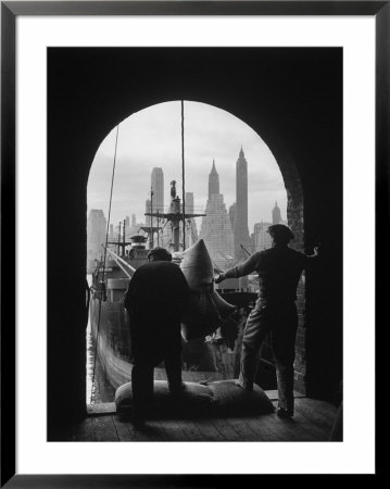 Men Unloading Coffee At Brooklyn Dock. View Of Downtown Manhattan In Background by Andreas Feininger Pricing Limited Edition Print image