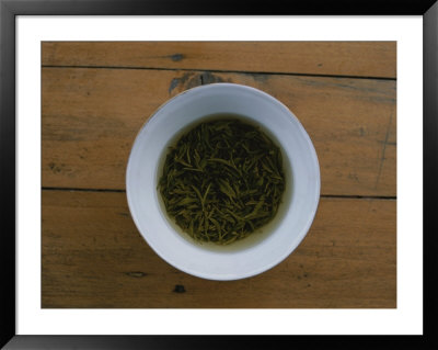 Tea Leaves Steep In A Cup Of Hot Water For Green Tea by Jodi Cobb Pricing Limited Edition Print image