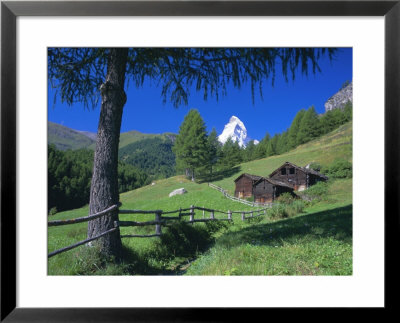 The Matterhorn Towering Above Green Pastures And Wooden Huts, Swiss Alps, Switzerland by Ruth Tomlinson Pricing Limited Edition Print image