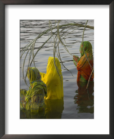 Three Women Pilgrims In Saris Making Puja Celebration In The Pichola Lake At Sunset, Udaipur, India by Eitan Simanor Pricing Limited Edition Print image