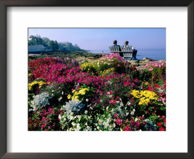 Couple Reading At Ocean Point Shoreline, Flowers In Foreground, Maine by John Elk Iii Pricing Limited Edition Print image