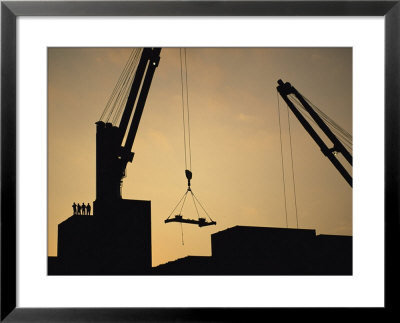 Silhouette Of Cranes And Workers At The Port Of Antofagasta by Joel Sartore Pricing Limited Edition Print image