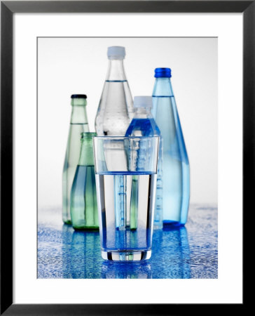 A Glass In Front Of Mineral Water Bottles by Alexander Feig Pricing Limited Edition Print image