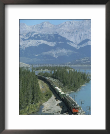 Canadian National Railways Goods Train Along Athabasca River, Jasper National Park, Rocky Mountains by Ursula Gahwiler Pricing Limited Edition Print image