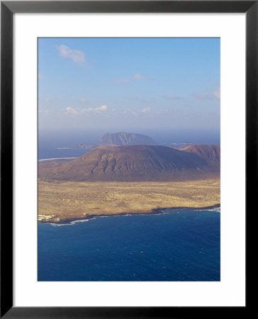 Aerial View Of La Graciosa Island Volcanoes From El Mirador Del Rio, Canary Islands, Spain by Marco Simoni Pricing Limited Edition Print image