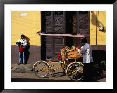 Street Vendor With Bicycle Cart Laden With Fruit And Vegetables, Mexico by Charlotte Hindle Pricing Limited Edition Print image