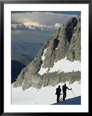 Skiers Contemplate A Storm Cloud Over The White Mountains In Nevada by Gordon Wiltsie Pricing Limited Edition Print image