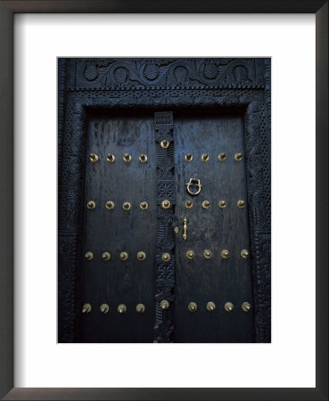 Traditional Carved Wooden Door In Stone Town, Zanzibar, Tanzania, East Africa, Africa by Yadid Levy Pricing Limited Edition Print image