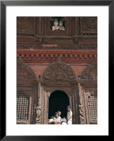Children Play Beneath The Figures Of Shiva And Parvati At A Temple In Durbar Square, Nepal by Don Smith Pricing Limited Edition Print image
