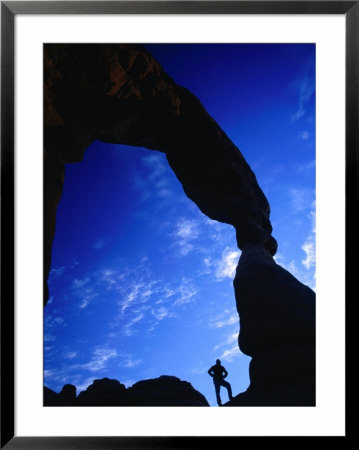 Hiker Silhouetted Beneath Delicate Arch, Arches National Park, Utah, Usa by Gareth Mccormack Pricing Limited Edition Print image