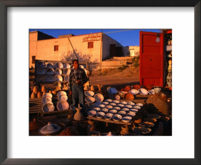 Boy Selling Ceramic Pottery From Roadside Stall, Tripoli, Libya by Patrick Syder Pricing Limited Edition Print image