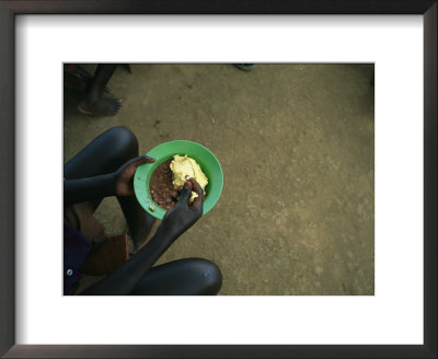Child Eats Lunch At Amazing Grace Orphanage by Stephen Alvarez Pricing Limited Edition Print image