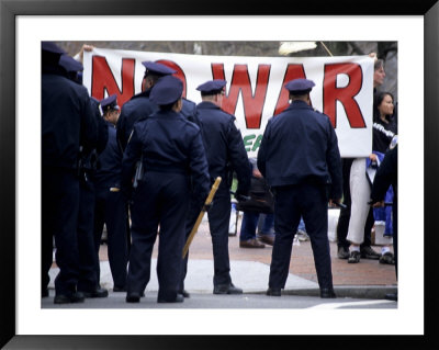 Police Face Protestors Demonstrating Against The War In Iraq by Stephen St. John Pricing Limited Edition Print image