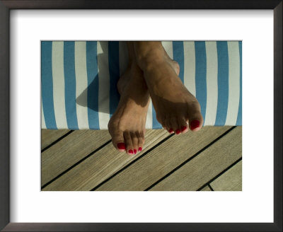 Woman's Feet On A Striped Cushion On The Deck Of A Cruise Ship by Todd Gipstein Pricing Limited Edition Print image