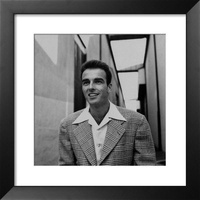 Montgomery Clift Standing Outside Sound Stages During The Filming Of A Place In The Sun by Peter Stackpole Pricing Limited Edition Print image