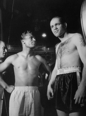 Boxers Bobo Olson And Sugar Ray Robinson Posing For Photos Before Their Match by Allan Grant Pricing Limited Edition Print image