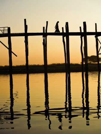 Young Woman Walking Across The Ubein Bridge In Mandalay, Burma At Sunset by Scott Stulberg Pricing Limited Edition Print image