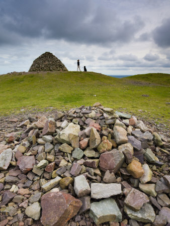 Stone Cairns And Dogwalker At Dunkery Beacon In Exmoor National Park, Somerset, England, Uk by Adam Burton Pricing Limited Edition Print image