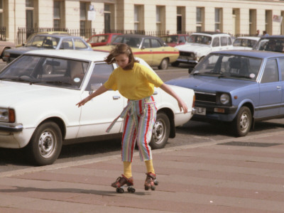 A Girl Rollerskating On The Pavement At Brighton by Vanessa Wagstaff Pricing Limited Edition Print image