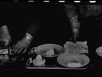 Nazi War Criminal Adolf Eichmann And Unidentified Guard Preparing His Breakfast At Djalameh Jail by Gjon Mili Pricing Limited Edition Print image