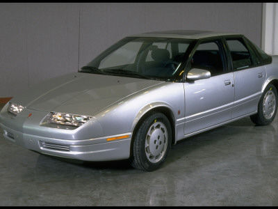 Spiffy New Silver Saturn Sl2 Sports Touring Sedan Manufactured By Gm In Spring Hill, Tn Plant by Ted Thai Pricing Limited Edition Print image