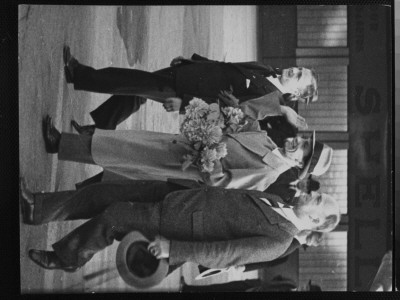 Nazi Propaganda Minister Goebbels Giving Nazi Salute And Holding Bouquet Of Flowers At Airport by Alfred Eisenstaedt Pricing Limited Edition Print image