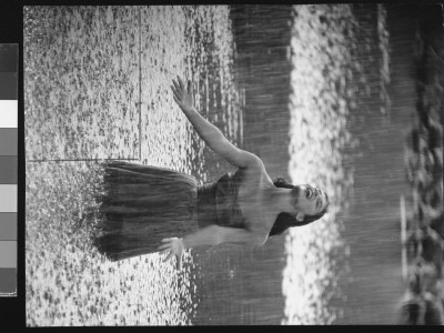 Actress Pier Angeli In Strapless Chiffon Party Dress, In A Downpour Of Rain In A Woodland Pond by Allan Grant Pricing Limited Edition Print image