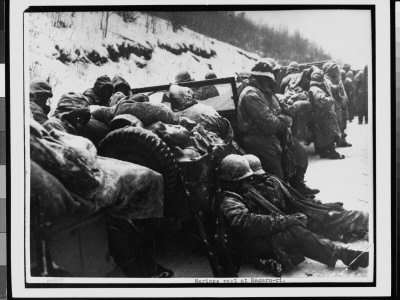Exhausted Us Marines Of 5Th And 7Th Regiments Rest Along A Snowy Road During Retreat by Frank C. Kerr Pricing Limited Edition Print image