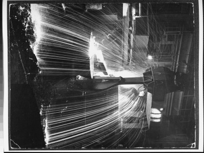 Molten Steel Being Poured From An Open Hearth Furnace At Carnegie-Illinois Steel Mill by Andreas Feininger Pricing Limited Edition Print image
