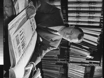 Actor Elliott Nugent Looking Over Old Theater Bills In New York Public Library by Alfred Eisenstaedt Pricing Limited Edition Print image