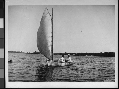 Mr. James Cornell And His Wife In Their Sailboat by Wallace G. Levison Pricing Limited Edition Print image