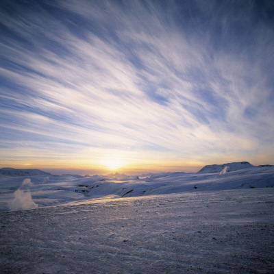 Snowy Landscape, The Sun Rising At Horizon With Golden Colours In The Sky And Clouds, Iceland by Throstur Thordarson Pricing Limited Edition Print image