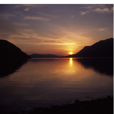 Reflection Of The Sun In A Lake At Sunset by Mick Barnard Pricing Limited Edition Print image