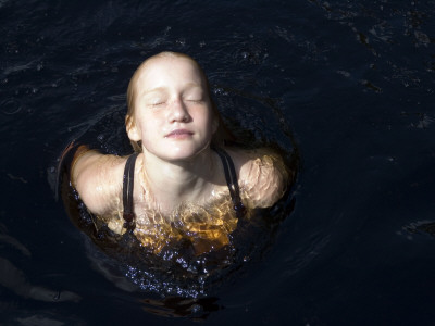 A Teenage Girl Swimming In The Sea, Sweden by Inger Bladh Pricing Limited Edition Print image