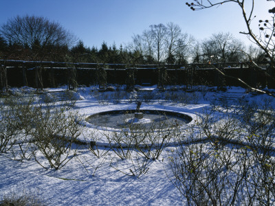 The Snow Covered Circular, Sunken Rose Garden At Great Fosters, Surrey by Clive Nichols Pricing Limited Edition Print image