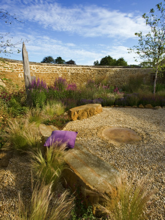 Gravel Garden With Rocks, Driftwood Sculpture And Stipa Tenuifolia by Clive Nichols Pricing Limited Edition Print image