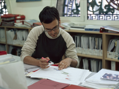 Office Life And Interiors, Office Worker At Desk by Nicholas Kane Pricing Limited Edition Print image