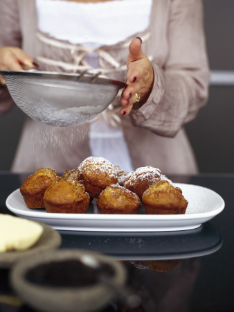 Cooper Residence, Omaha Beach, New Zealand, Detail Of A Woman Dusting Cakes With Sugar by Richard Powers Pricing Limited Edition Print image