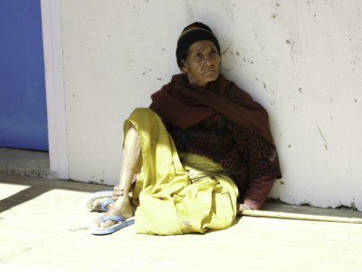 Old Woman Sitting Against A Wall, Nepal by David D'angelo Pricing Limited Edition Print image