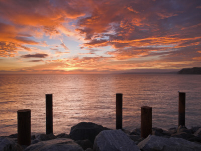 Spectacular Sunset Over West Bay In Dorset, England. Jurassic Coast World Heritage Site by Adam Burton Pricing Limited Edition Print image