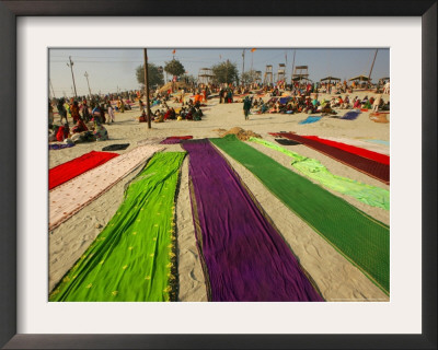 Clothes Of Hindu Devotee Are Laid Out To Dry After Being Drenched During Ritualistic Holy Dips by Aman Sharma Pricing Limited Edition Print image