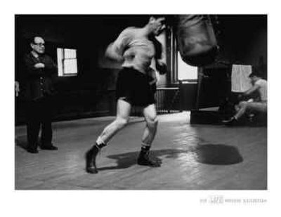 Life® - Walter Cartier Working The Heavy Bag With Charlie Goldman, 1951 by Eliot Elisofon Pricing Limited Edition Print image