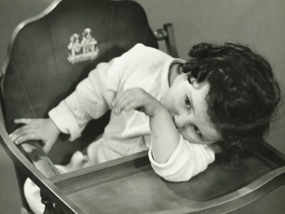 Girl (3-4) Sitting In High Chair by George Marks Pricing Limited Edition Print image