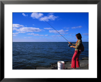 Woman With Fishing Rod, Grand Haven, Mi by Barry Winiker Pricing Limited Edition Print image