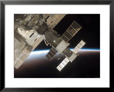 The Docked Soyuz 13 (Tma-9) (Foreground) And Progress 22 Resupply Vehicle by Stocktrek Images Pricing Limited Edition Print image