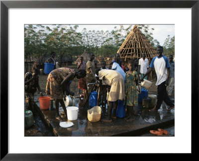 Women Collecting Water At The Dimma Refugee Camp, Ethiopia, Africa by D H Webster Pricing Limited Edition Print image