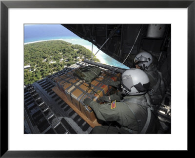 Airmen Push Out A Pallet Of Donated Goods Over The Island Of Yap From C-130 Hercules, Dec 19, 2008 by Stocktrek Images Pricing Limited Edition Print image