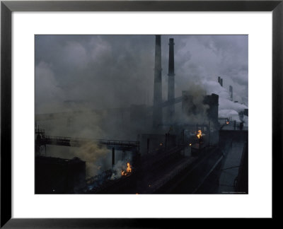 Smoke Spews From The Coke Production Section Of A 1950S Steelworks by James L. Stanfield Pricing Limited Edition Print image