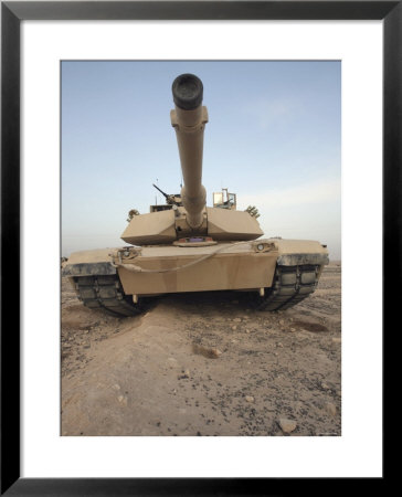 An M-1A1 Main Battle Tank Casts A Daunting Image In The Desert Near Dra Digla, Iraq by Stocktrek Images Pricing Limited Edition Print image