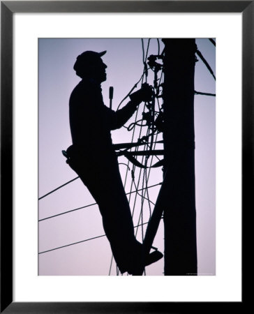 Silhouette Of Engineer Working Up A Telegraph Pole, East Sussex, England, United Kingdom by Ruth Tomlinson Pricing Limited Edition Print image